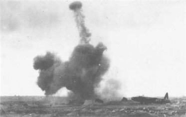 Bomb exploding at Malta airfield.  http://www.killifish.f9.co.uk/Malta%20WWII/Photo's/Bomb%20Damage/BD12.jpg